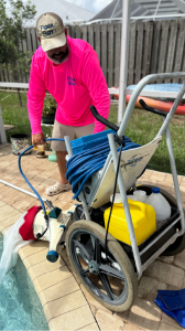 Green Pool Cleaning by Pool Boy Inc. – Charlotte County, FL Pool Boy Inc. technician performing green pool cleaning in Charlotte County with professional equipment
