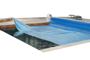 Solar pool blanket covering an in-ground pool to retain heat and reduce energy loss in Charlotte County, FL.