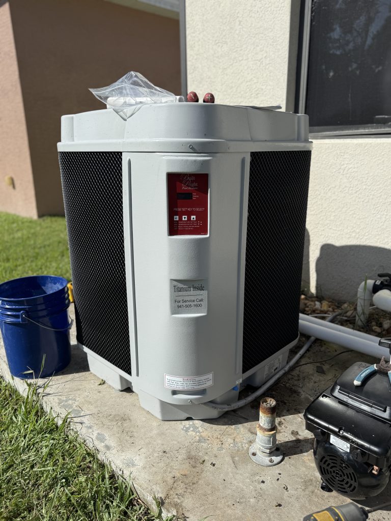 Built Right electric pool heaters installed by Pool Boy in Charlotte County, Florida, showing a modern, energy-efficient system ready to heat a residential pool.