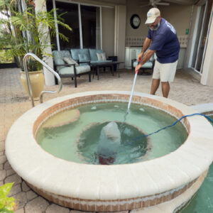 Spa Vacuuming During 21-Point Pool Inspection